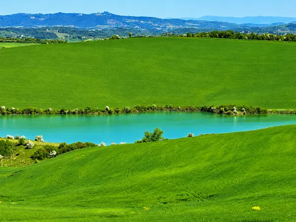 Jewish Florence Tuscany tours โ turquoise lake and Tuscan hills